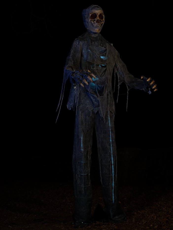 Towering at a terrifying 12 feet, this Lighted Zombie is ready to haunt the night! With glowing lights and eerie details, it's the ultimate spine-chilling centerpiece for your haunted display, ensuring frights from near and far.