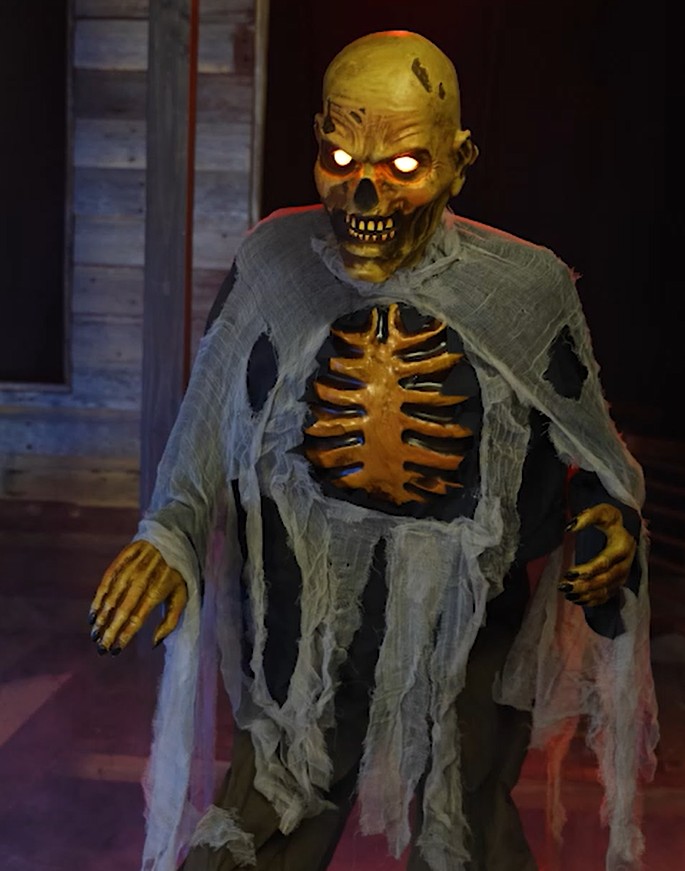 The Lumbering Zombie Animatronic is a spine-chilling addition to any haunted setup, bringing eerie undead vibes to your Halloween display with its gruesome design.