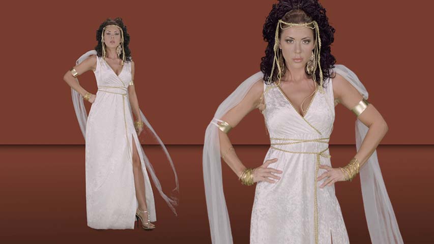 Mortal men will bow to this legendary goddess. A crushed velour dress with gold with gold braided trim is inspired by the classic silhouettes of Ancient Greece. This look is finished with sheer white veils attached and an exotic gold headpiece.