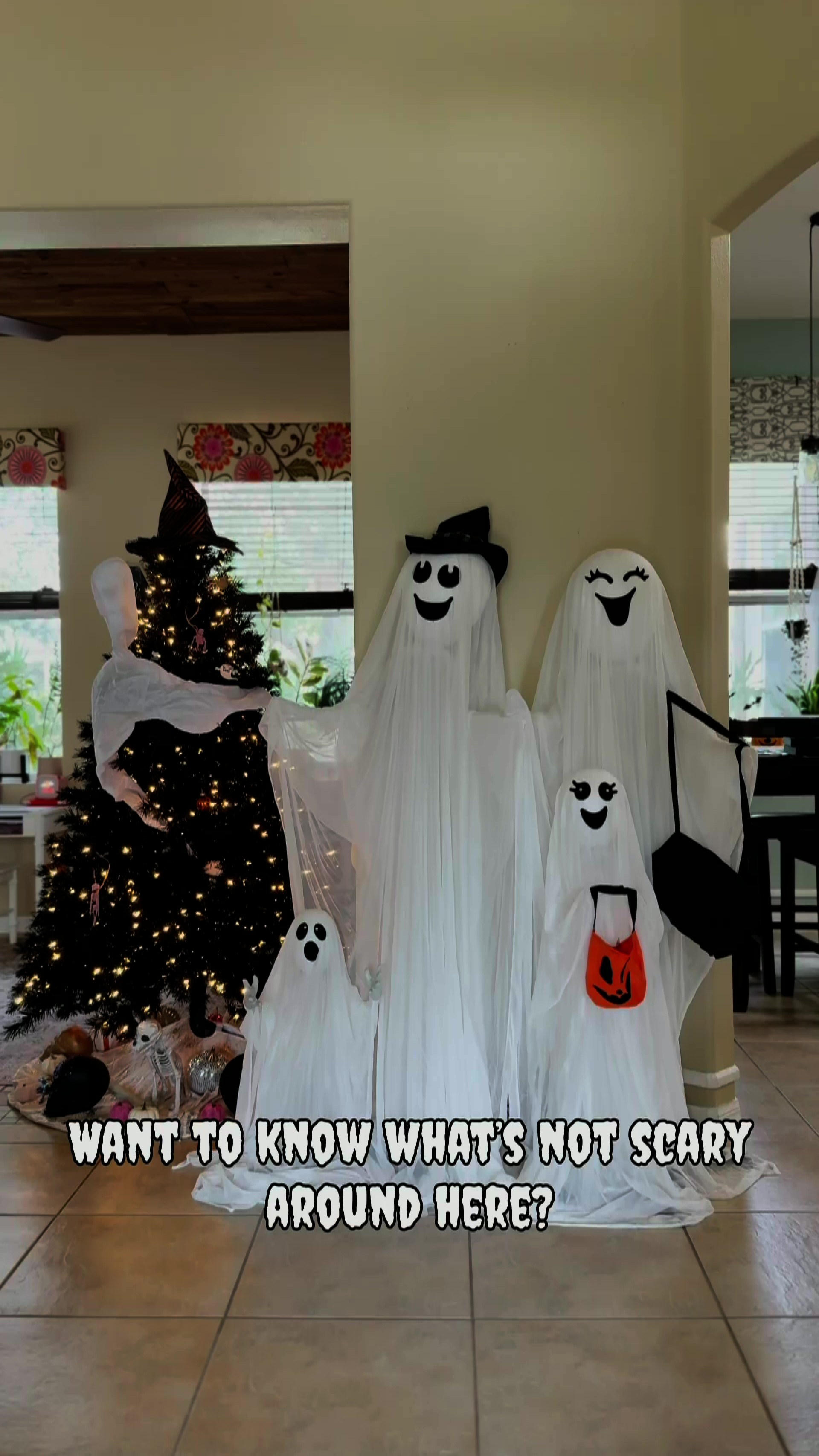 Add a cheerful fright to your display with the Light Up High Spirited Ghost Family Decoration, glowing with playful Halloween spirit for all ages.